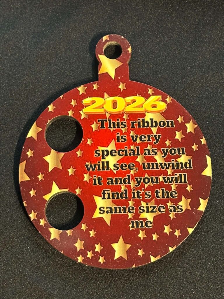Christmas Ribbon Bauble – Measure Your Little One With Some Ribbon And Then Tie Through The Holes To See How Much They Grow Each Year